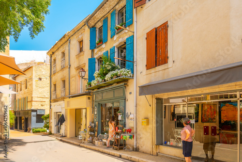 Fototapeta Naklejka Na Ścianę i Meble -  A picturesque street of shops and galleries in the historic medieval center of Saint-Remy de Provence, France.