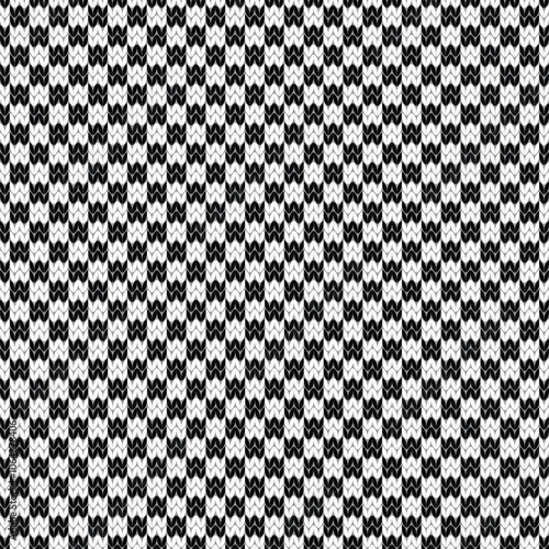 Black and white checkered knitted seamless pattern.  Jacquard knitting texture background. Vector illustration.