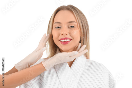 Beautician examining face o...