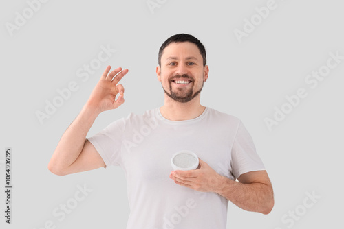 Young man with tooth powder...