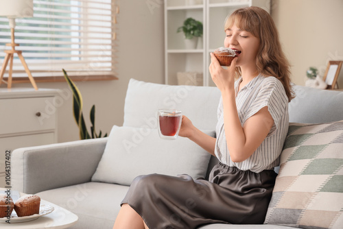Young woman with cup of tea...