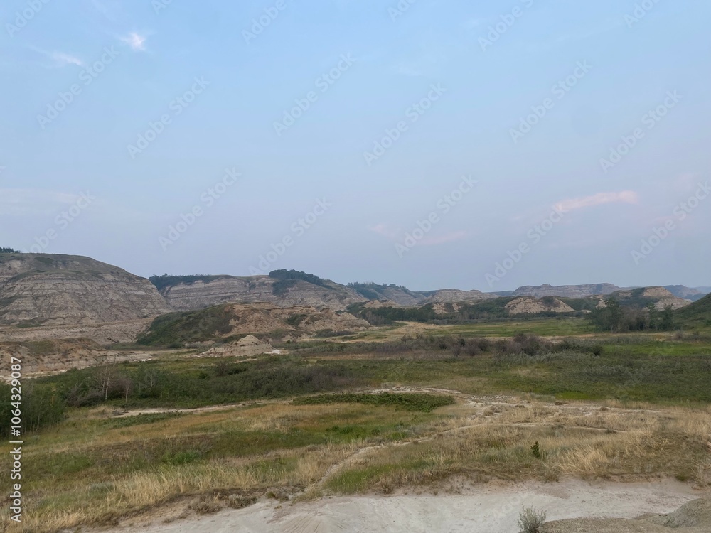 vast mountain views with blue bright sky and green fields. vast mountain views with blue bright sky and green fields.