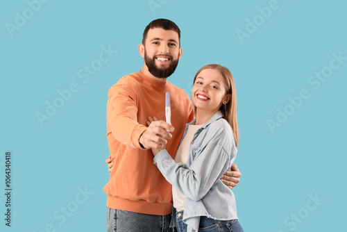 Happy young couple with pre...