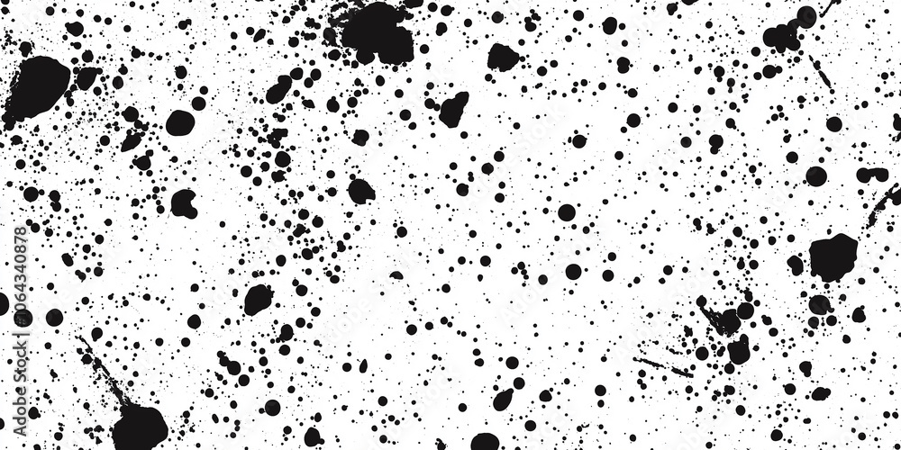 Black ink splattering on white background creating abstract design Black ink splattering on white background creating abstract design