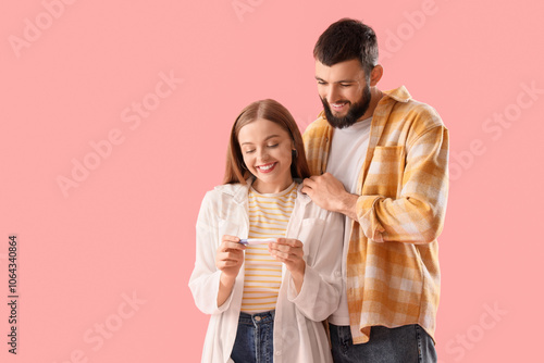 Happy young couple with pre...