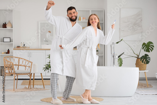 Happy young couple with pre...