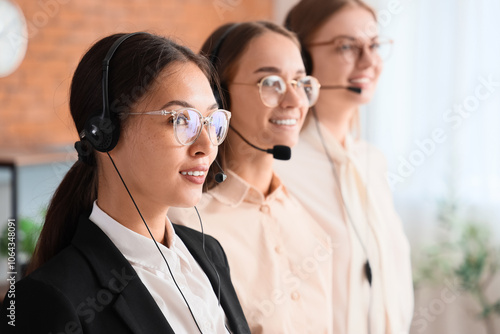 Team of female technical support agents smiling in office, closeup