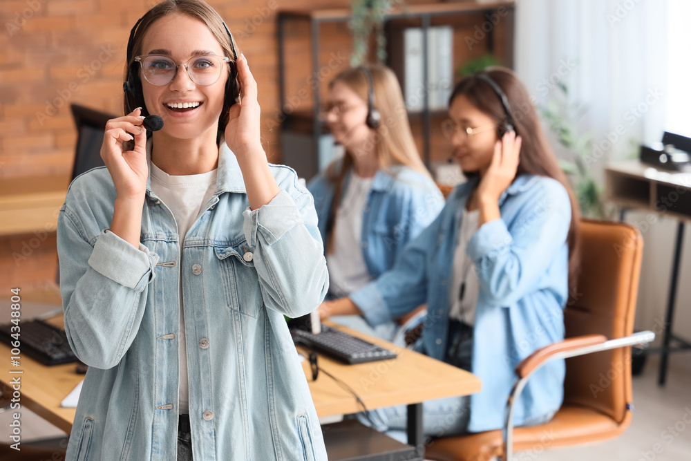 Female technical support agent with headset in office Female technical support agent with headset in office