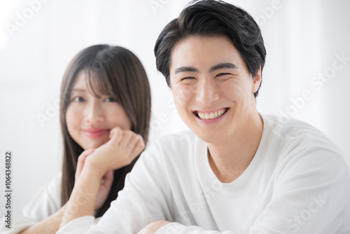 Close-up of a man and woman looking at the camera as a couple Focus on the man