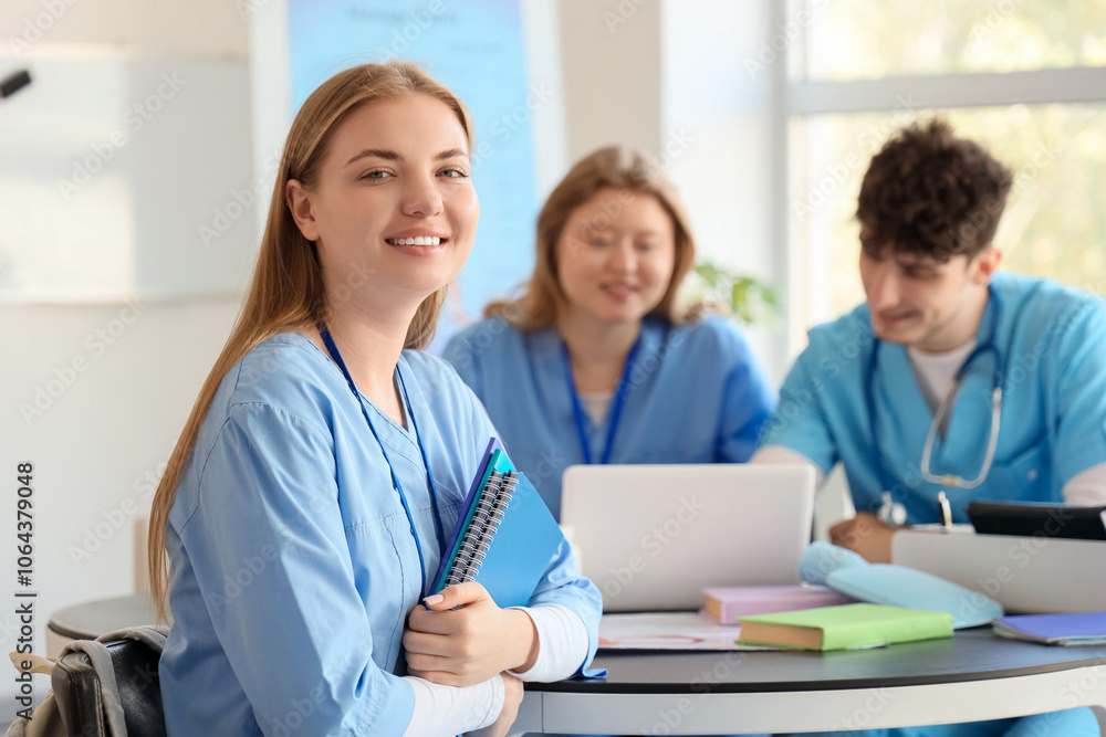 Female medical student with notebooks studying at university Female medical student with notebooks studying at university