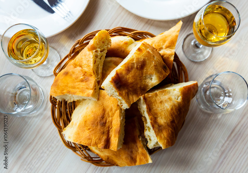 Sliced bread baked in tone oven traditionally served for lunch in georgian restaurant. photo