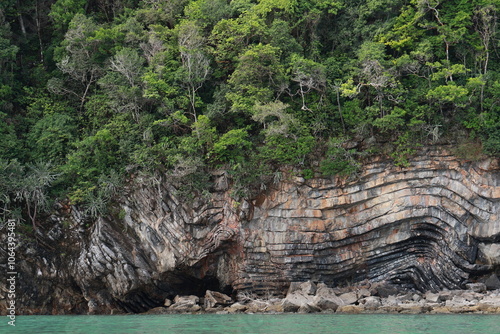 Pancake Rock is rock formation is found in middle of Khanom Sea in Thailand. It is a series of layered stone slabs covered with lush green forest. Geological wonders found in middle of Khanom Sea.
 photo