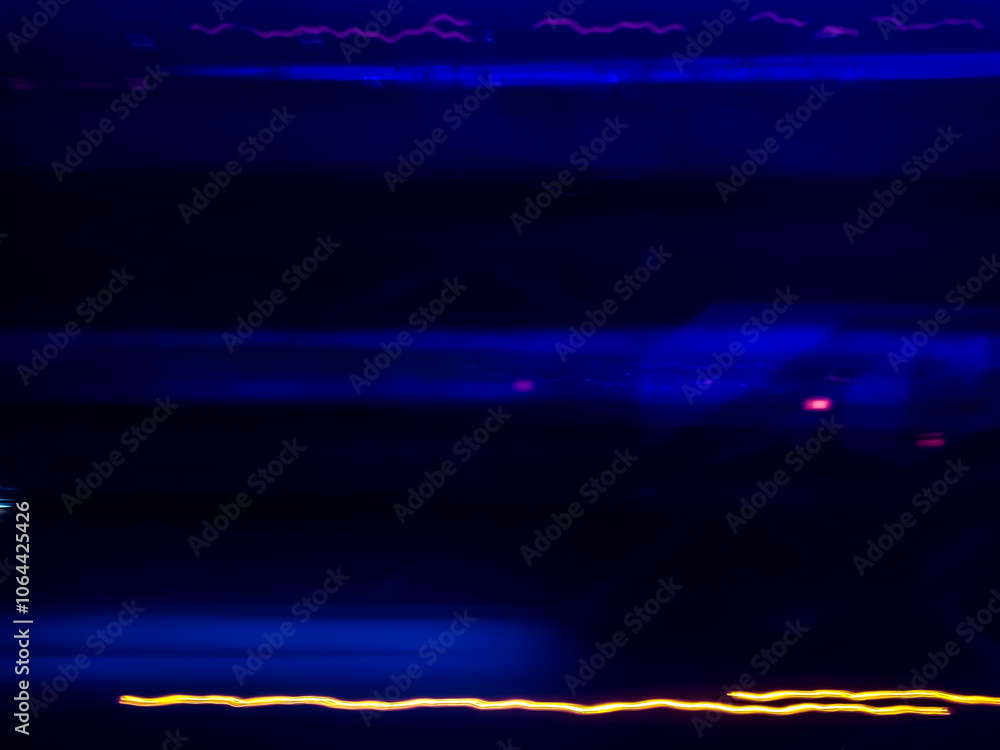 Naklejka premium Abstract light art background with dynamic movement is the result of light painting photography capturing speed and energy with elegant lines of light.