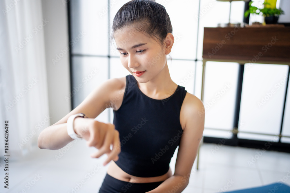 Sporty asian woman in sportswear with health app on smart watch After Exercise wellness health sportswoman wellness health Sporty asian woman in sportswear with health app on smart watch After Exercise wellness health sportswoman wellness health