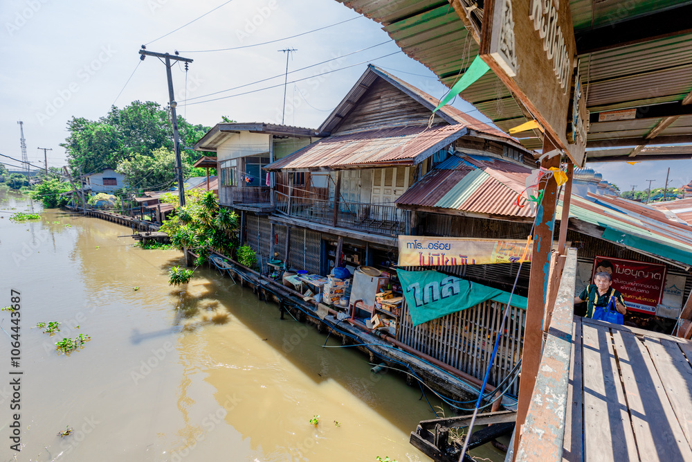 Background of high angle view from wooden bridge in community market area crossing canal at tourist attraction, community lifestyle of people living together in a mutually beneficial way. Background of high angle view from wooden bridge in community market area crossing canal at tourist attraction, community lifestyle of people living together in a mutually beneficial way.