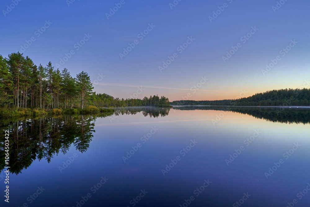 Serene dusk lake landscape with reflections. Serene dusk lake landscape with reflections.