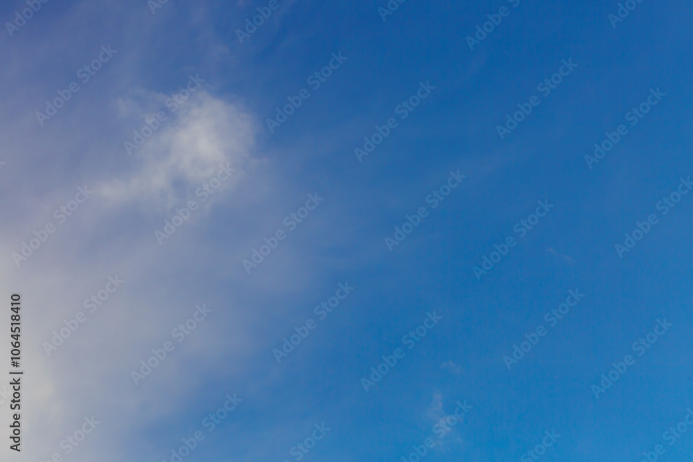 Fototapeta premium White heap clouds in the blue peaceful sky. The concept of psychological calmness and health. Peace of mind with the forces of nature. Air travel concept.