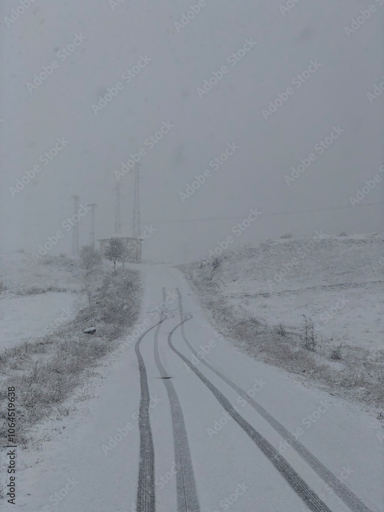 tire tracks of a car unable to climb a ramp in heavy snowfall in the Caucasus tire tracks of a car unable to climb a ramp in heavy snowfall in the Caucasus