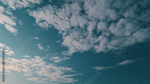 Light high altostratus clouds slide on sky. Cloud nature skyscrapers. Scenic altostratus clouds. photo