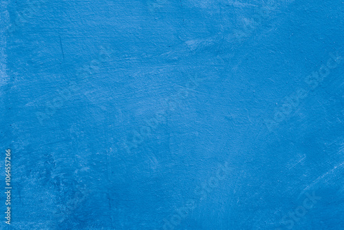 Grunge classic blue concrete background. Textured plaster wall. Creative backdrop for your design. Color of the year 2025 concept. Top view, layout for design. Surface with peeling shabby pattern.