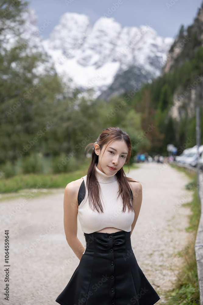 Woman walking in the pine forest dolomites, Italy. Woman walking in the pine forest dolomites, Italy.