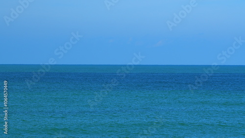 Blue Water Waves Surface. Sun Glare On Blue Water View Summer. Pan.