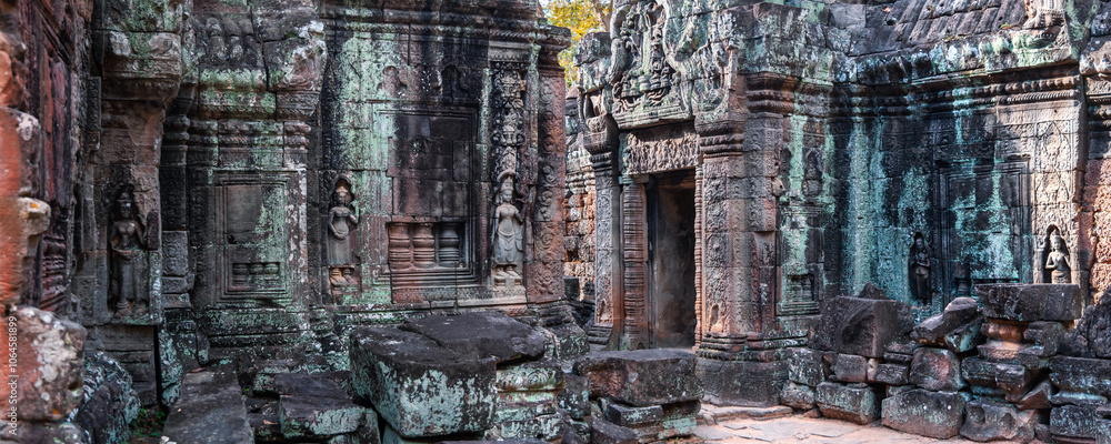 Naklejka premium Preah Khan temple interior in Cambodia, rock entrance corridor.