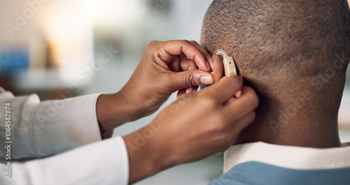 Fotografía Man, ear and hearing aid fitting with hands, medical support and care with implant for sound and audio