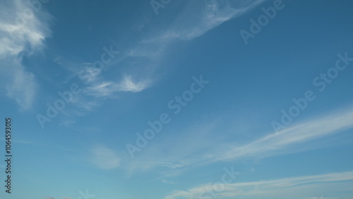 Daylight exotic horizon in tropical summer sunlight. Beautiful sunny blue sky background with tiny cirrus clouds. photo