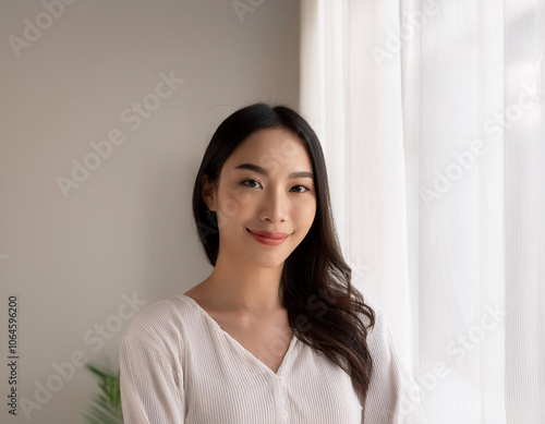 Portrait of Young Beautiful Woman in Sustainable Minimalist Clothing Indoors