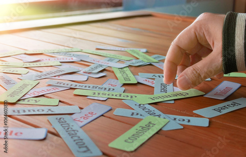 hand picking up cards in class