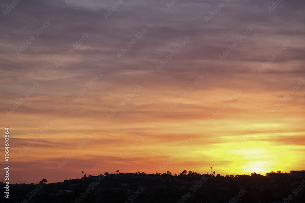 Panoramic sunrise or sunset dusk dawn landscape nature coastal scenery with beautiful fire sky and dramatic cloudscapes over California coast range view near Los Angeles Panoramic sunrise or sunset dusk dawn landscape nature coastal scenery with beautiful fire sky and dramatic cloudscapes over California coast range view near Los Angeles