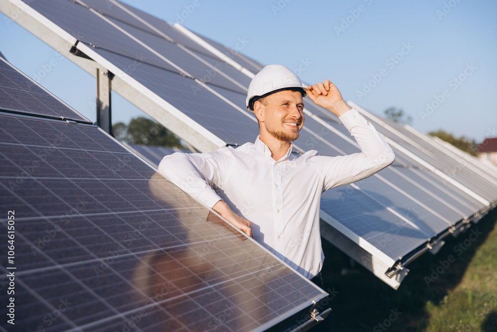 Engineer Inspecting Solar Panels On A Sunny Day Engineer Inspecting Solar Panels On A Sunny Day