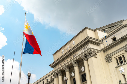 The exterior of the National Museum of Philippine Fine Arts in Manila, Philippines, with the Philippine flag.
