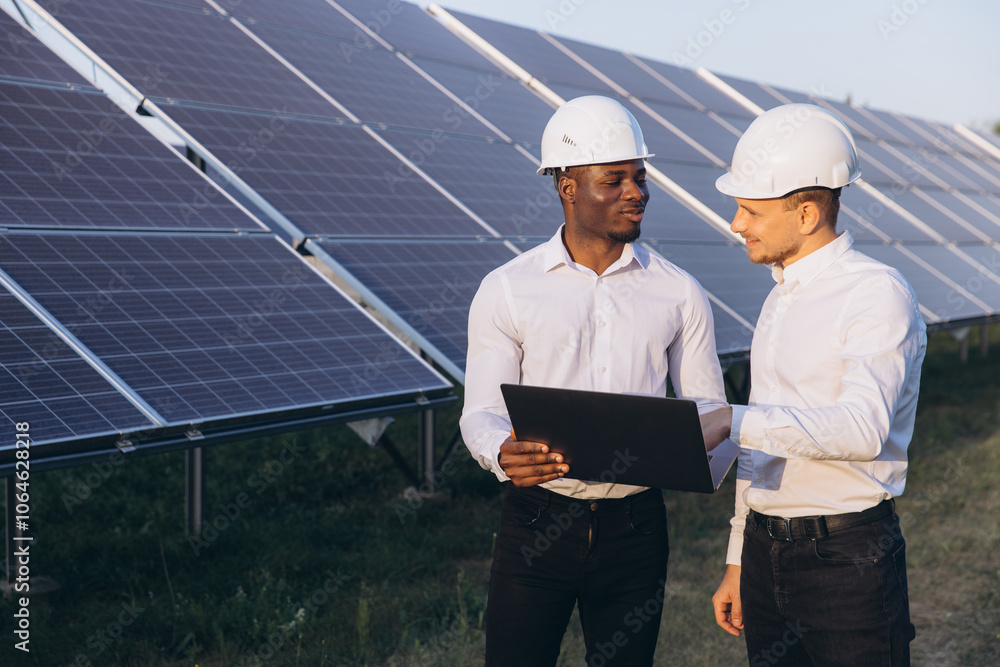 Two Engineers Discussing Solar Panel Project Outdoors Two Engineers Discussing Solar Panel Project Outdoors