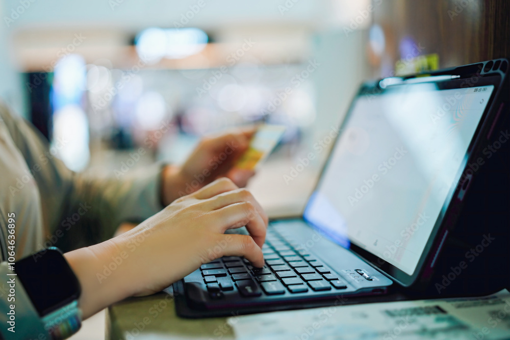 Modern E-Commerce: A Woman Making an Online Purchase with a Credit Card Modern E-Commerce: A Woman Making an Online Purchase with a Credit Card