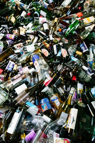 High angle close up of a heap of recycled glass bottles