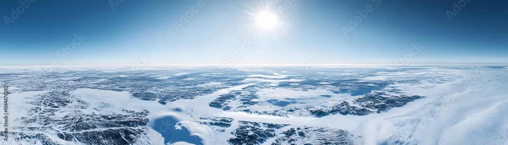 Fototapeta premium Aerial View of a Vast, Icy Landscape Under a Bright Blue Sky
