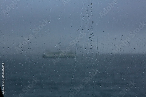 Puget Sound ferry seen through a wet window