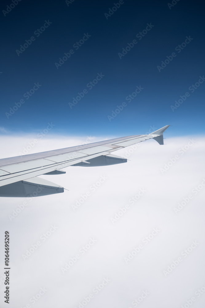 Fototapeta premium The airplane flew over the clouds. 