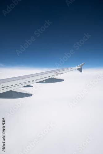 The airplane flew over the clouds.	 photo