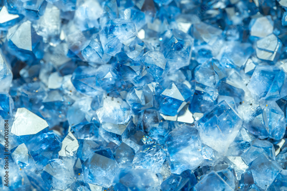 Blue Crystal Mineral Stone. Gems. Mineral crystals in the natural environment. Texture of precious and semiprecious stones. Seamless background with copy space colored shiny surface of precious stones Blue Crystal Mineral Stone. Gems. Mineral crystals in the natural environment. Texture of precious and semiprecious stones. Seamless background with copy space colored shiny surface of precious stones