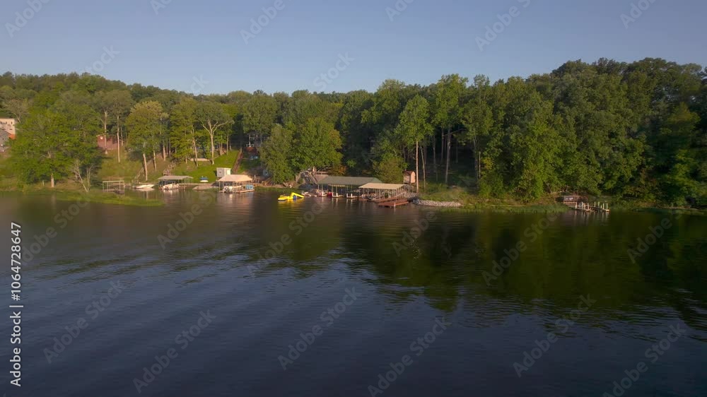 Aerial drone video flying toward a boat dock and lakehouse on Lake of Egypt, Southern Illinois. Aerial drone video flying toward a boat dock and lakehouse on Lake of Egypt, Southern Illinois.