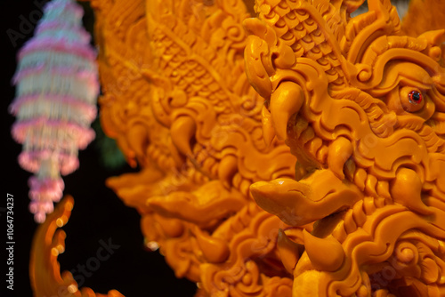 NAKHONRATCHASIMA, THAILAND - JULY 11: Candle wax carving Thai style texture in the traditional parade active festival Buddhist Lent on JULY 11, 2019 in Nakhon Ratchasima, Thailand. photo