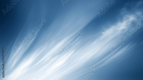 A serene blue sky with wispy clouds creating a tranquil atmosphere.