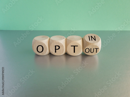Obraz na płótnie Concept words opt out and opt in on cubes. Beautiful grey table green background. Business concept. w salonie