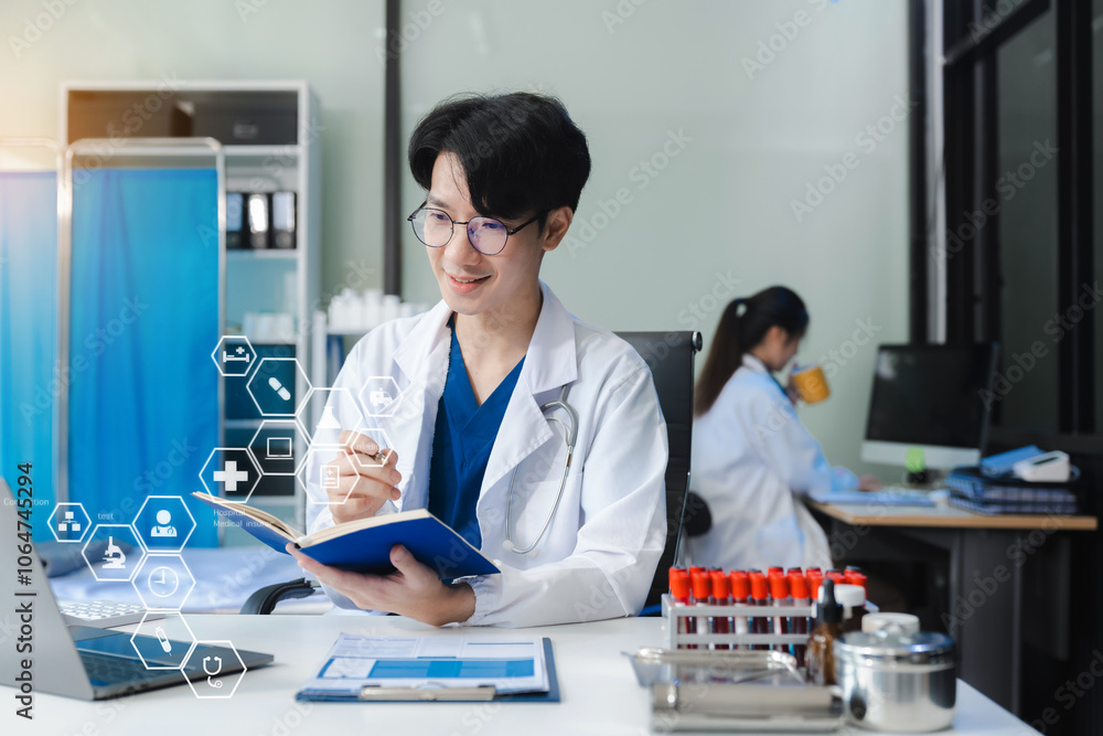 doctor is working on a smartphone and a digital laptop computer. doctor is working on a smartphone and a digital laptop computer.
