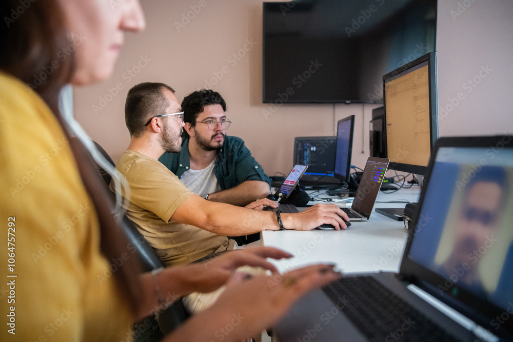 Top view of programmer diligently testing smartphone applications while sitting in their office. Top view of programmer diligently testing smartphone applications while sitting in their office.