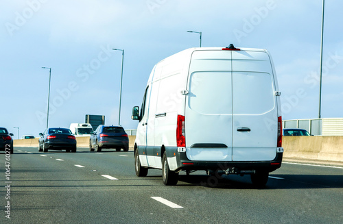 A White Van Travelling Along A Motorway Currently Sitting In The Fast Lane