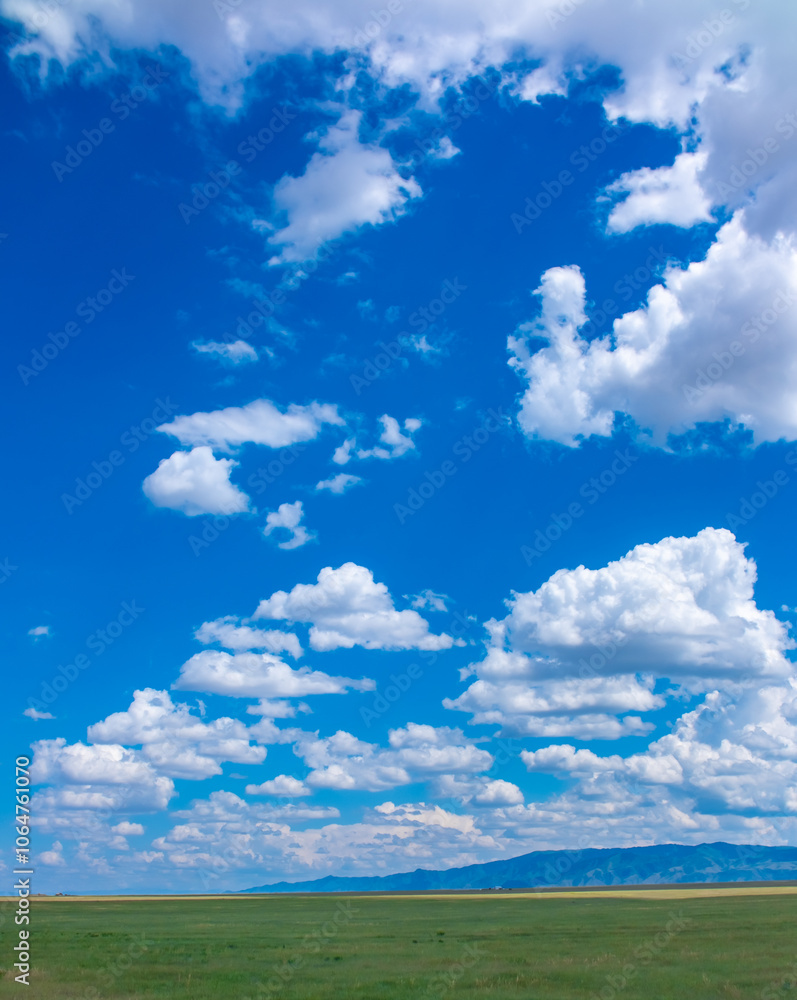 Panoramic view of sky with clouds over green field. Beautiful landscape with fluffy clouds. Panoramic view of sky with clouds over green field. Beautiful landscape with fluffy clouds.
